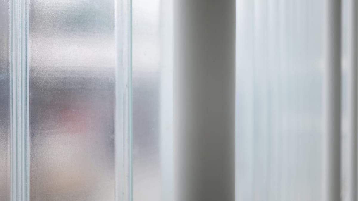 Frosted glass panels with soft daylight behind them